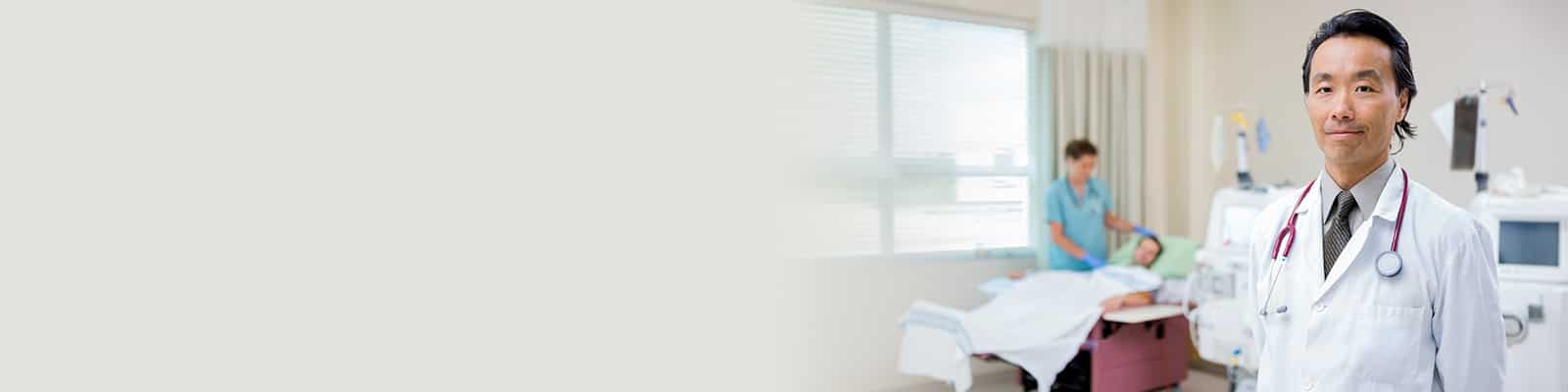 A doctor and a nurse with a resident for his Onsite DaVita Dialysis